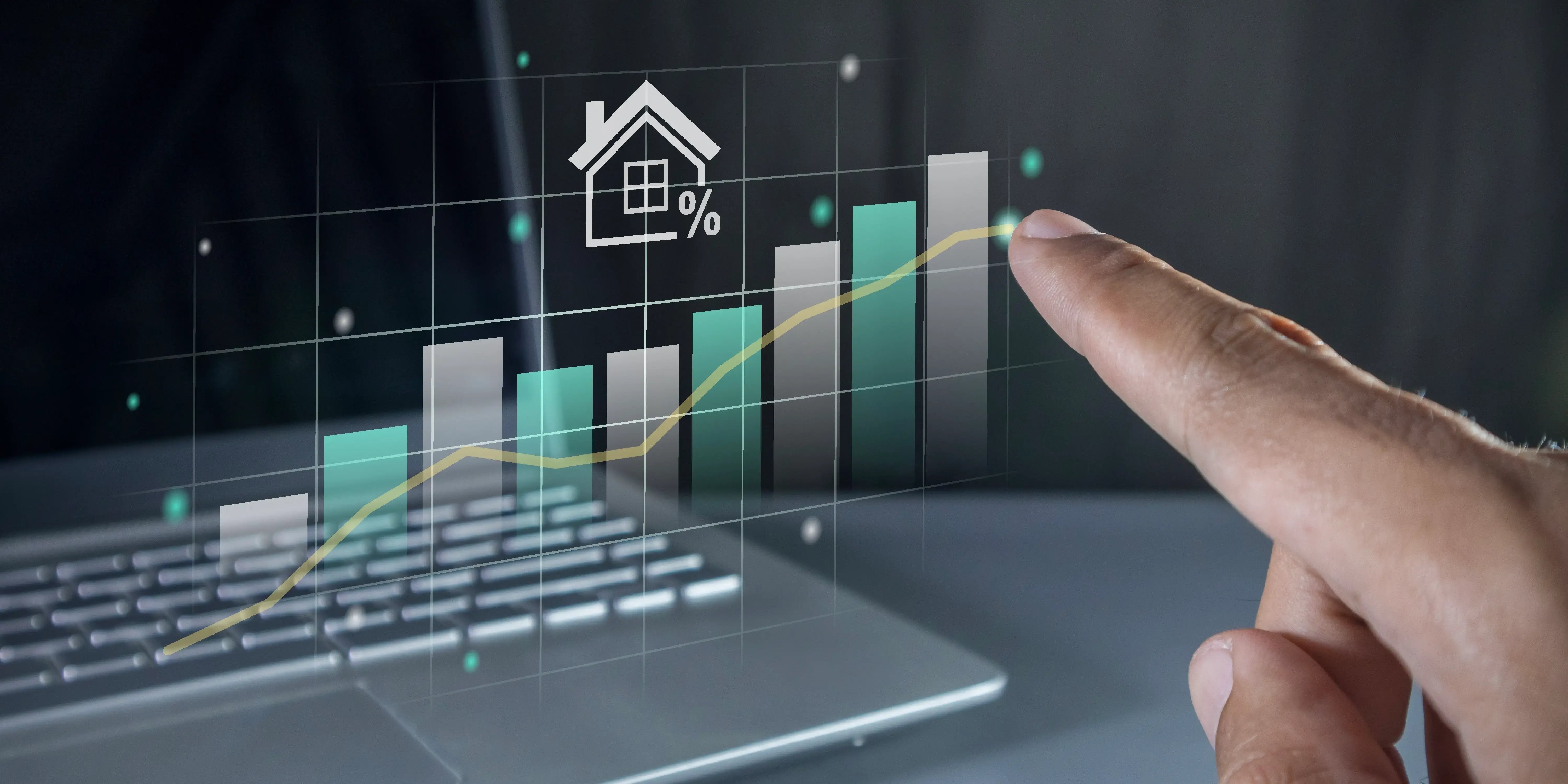 Mano que apunta a un gráfico virtual. El Precio de la casa en Bosque Real se eleva